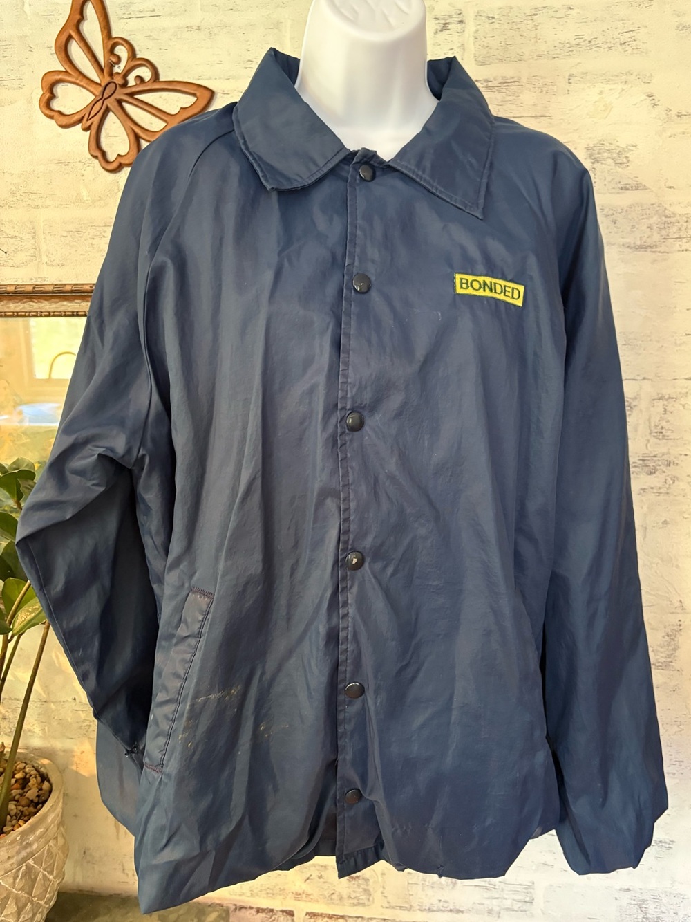Vintage Blue nylon coach's jacket with a "BONDED" patch